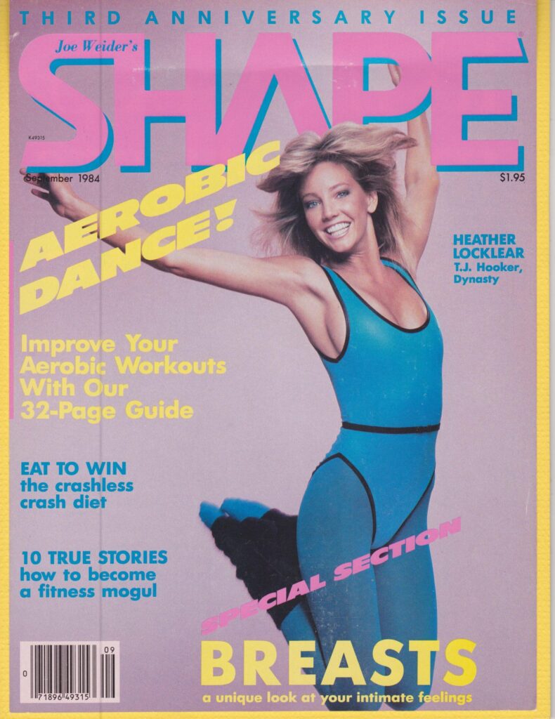 The September 1984 3rd Anniversary issue of Shape Magazine featuring Heather Locklear. She is captured mid-air in a fitness pose wearing a Carushka Bodywear leotard in royal blue matisse with black trim, paired with matching blue leggings and black leg warmers.
